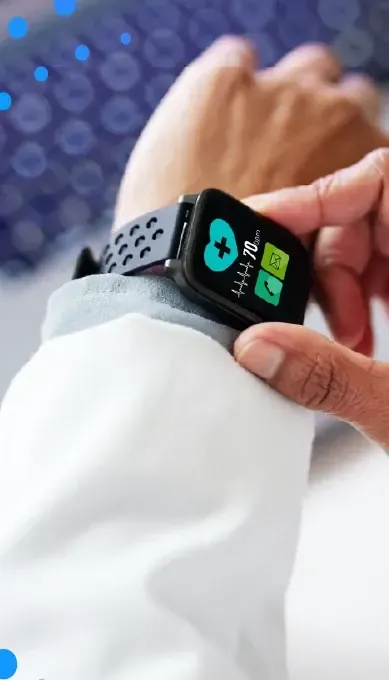 Person in a lab coat checking a smartwatch