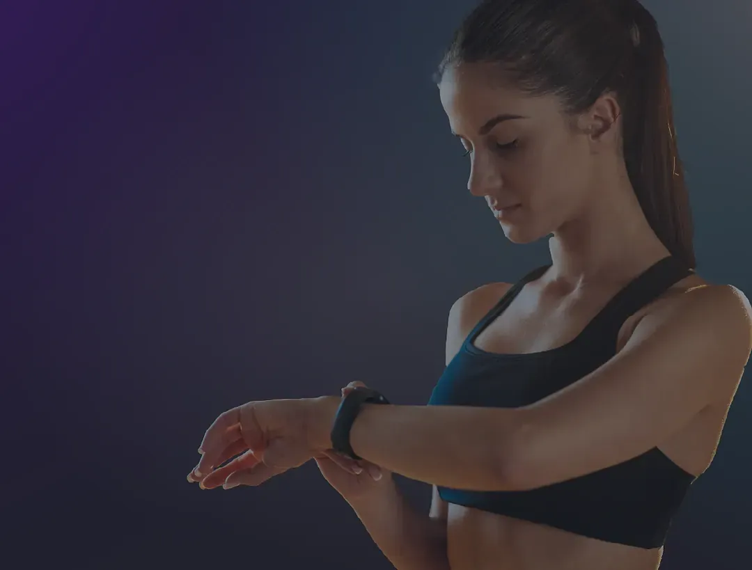 Woman checking her smartwatch after a workout