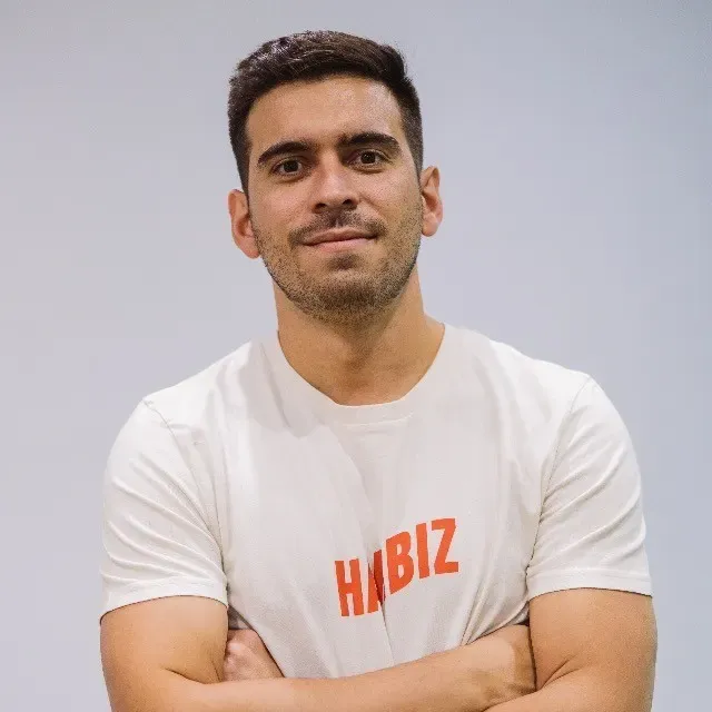 Javier Ortega Bueno, co-founder and COO of Harbiz, in a Harbiz T-shirt