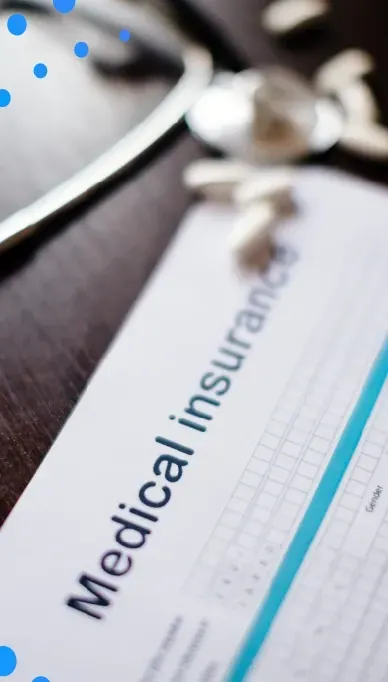 Medical insurance form next to a stethoscope